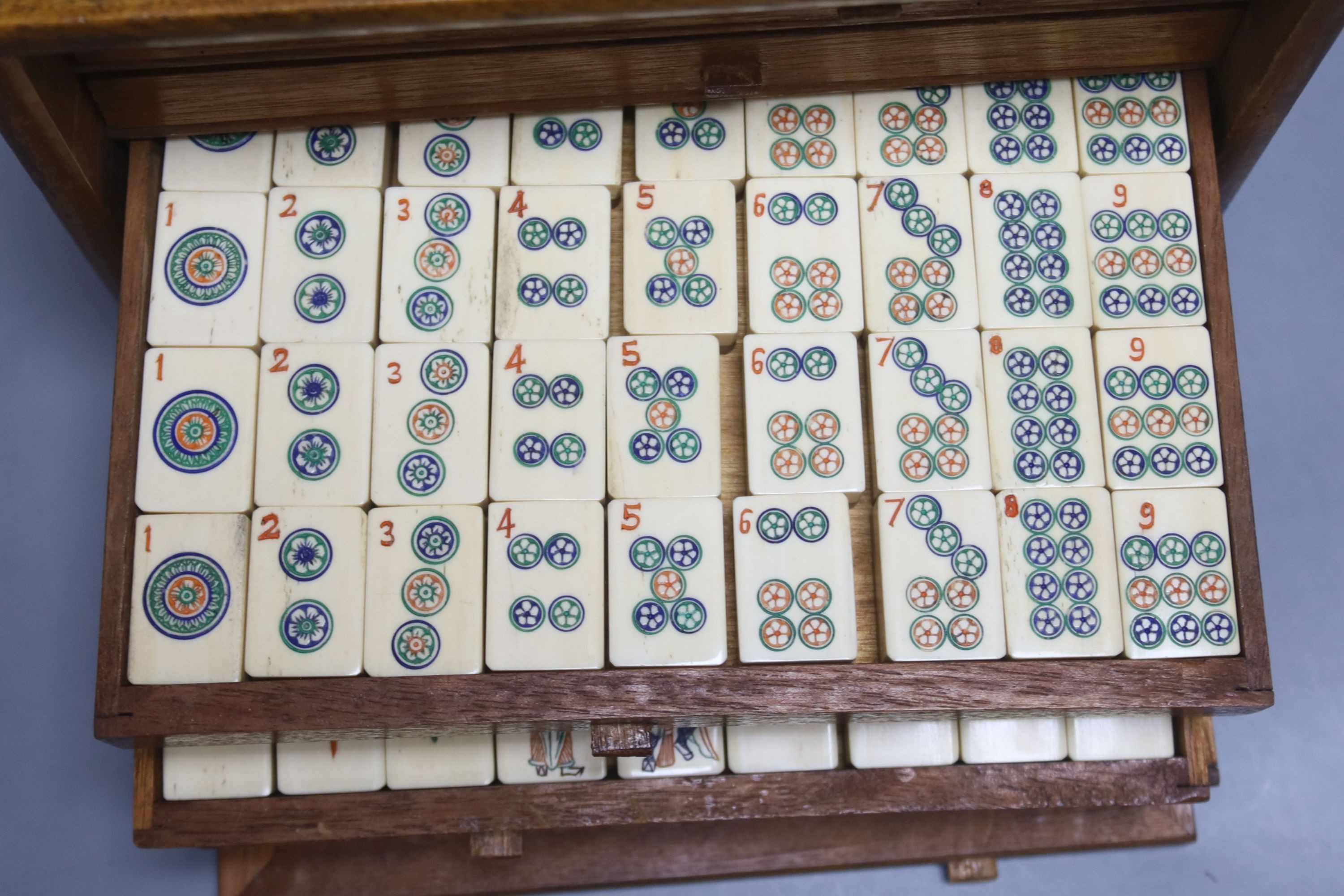 A Chinese hardwood cased mah jong set